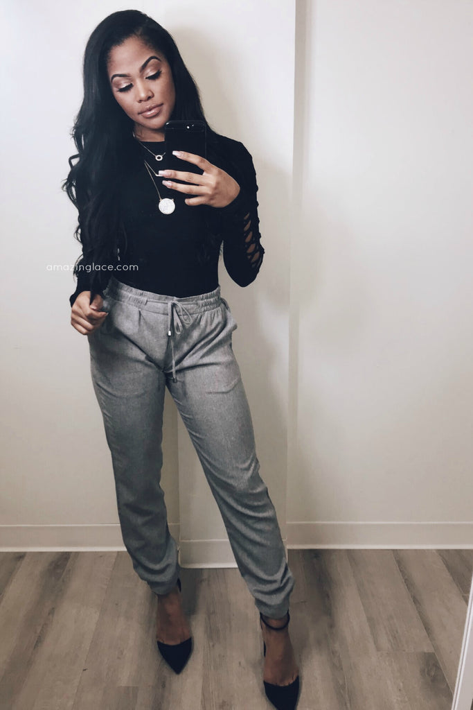 BLACK BODYSUIT AND GRAY DRAWSTRING PANTS OUTFIT