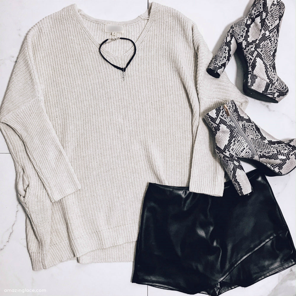 IVORY SWEATER AND BLACK SKORT WITH SNAKE SKIN BOOTS OUTFIT