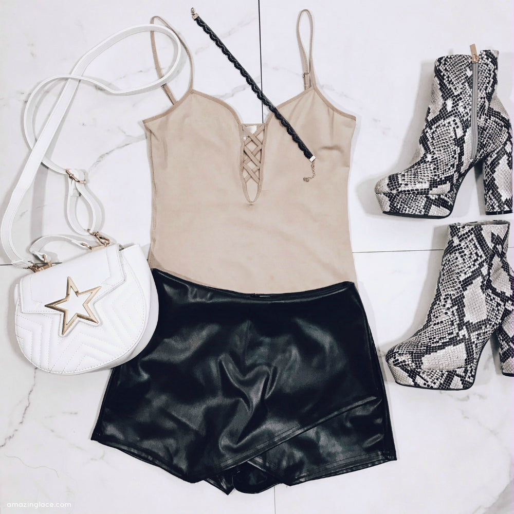 NUDE BODYSUIT BLACK SKORT AND STAR BAG OUTFIT