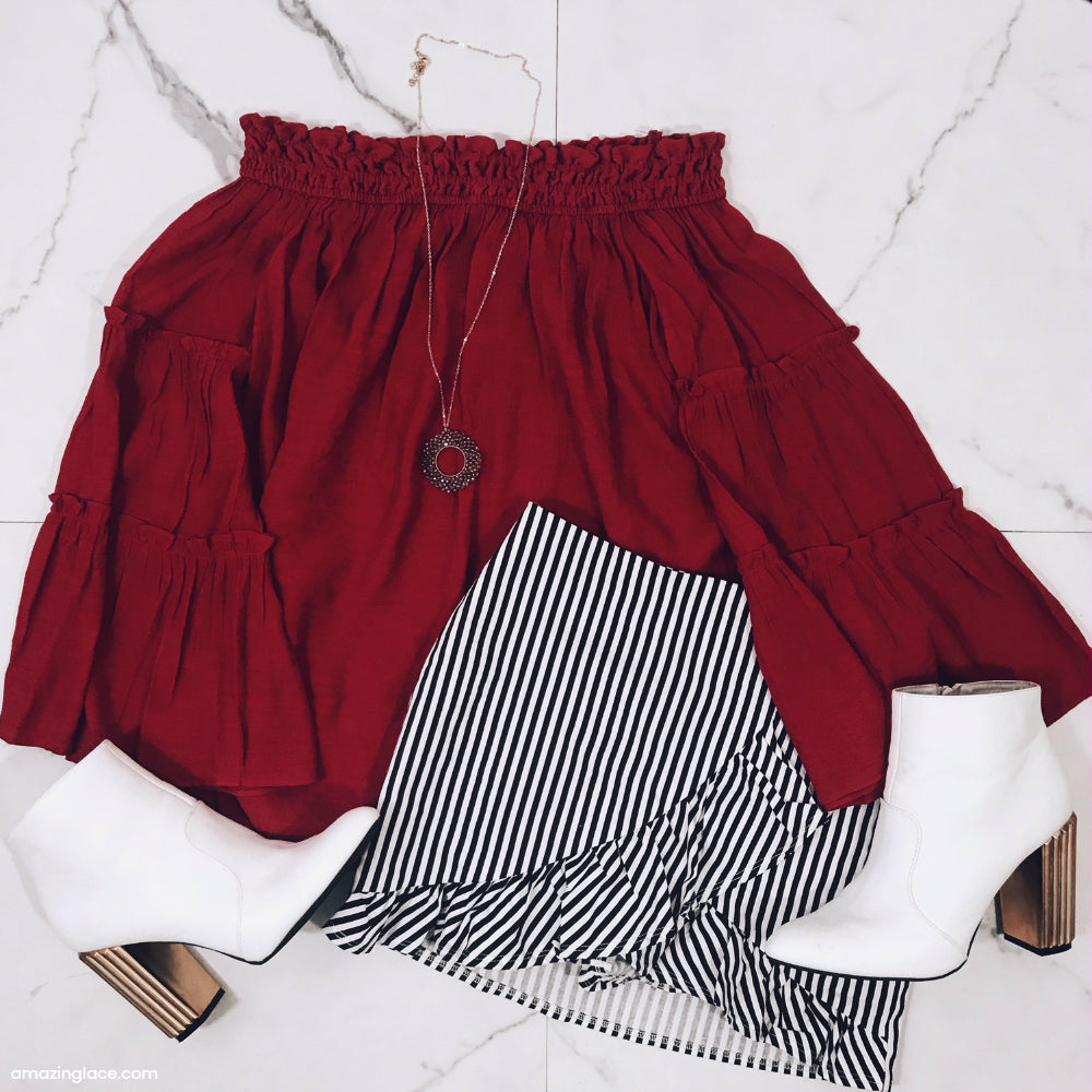 RED OFF THE SHOULDER TOP AND STRIPED SKORT OUTFIT