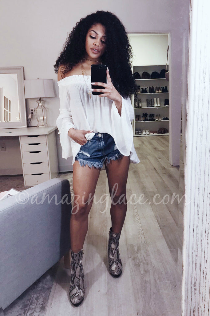 WHITE OFF THE SHOULDER TOP AND BLUE DISTRESSED SHORTS OUTFIT