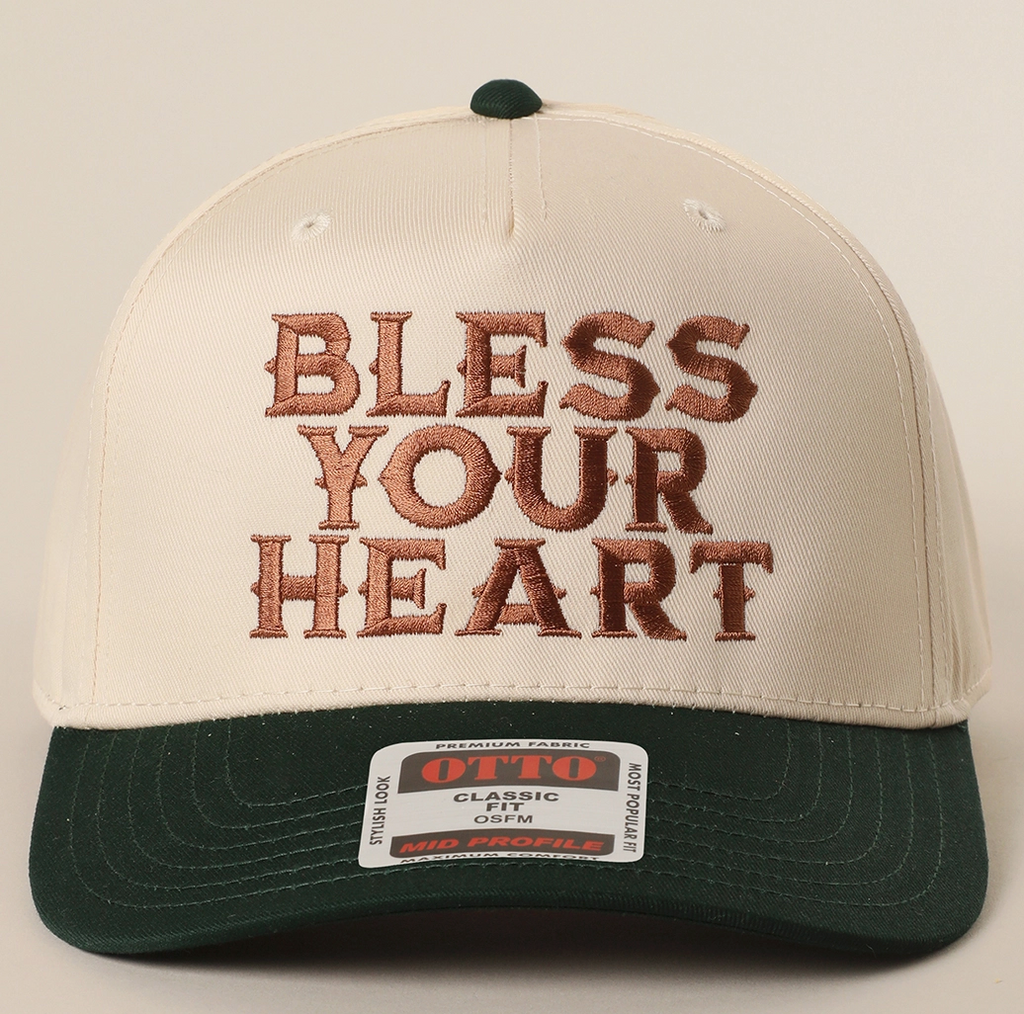 Cap with 'Bless Your Heart' text on a beige and black background