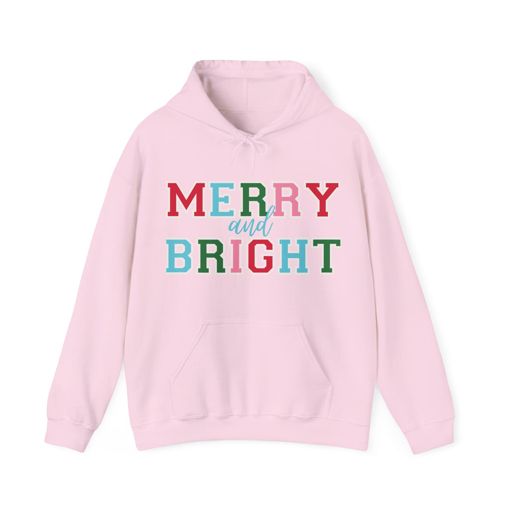 Pink hoodie with 'Merry and Bright' text in multicolor on a white background